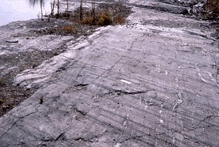 Prior to glacial retreat, the bedrock surface was abraded by rock debris dragged along under great pressure at the base of the ice sheet.