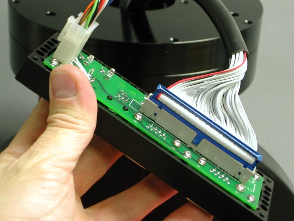 After the cables are passed through the Versa-Plate cable channel, they must be plugged into the appropriate slots on the Instrument Panel s control board.