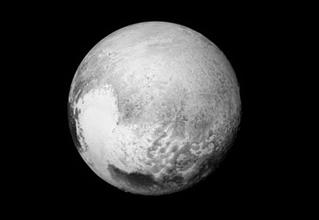 Pluto s Surface This image provides new details to help map the informally named Krun Macula (the prominent dark spot at the bottom of the image) and the complex terrain east and northeast of Pluto s