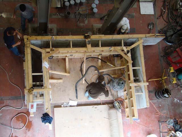 Once the specimen reached 2000 psi (13.8 MPa), the specimen was lifted and positioned in the loading frame to be tested. Figure 11 is a photo of Specimen 1 formwork. Figure 11. Typical formwork prior to casting (Specimen 1 shown).