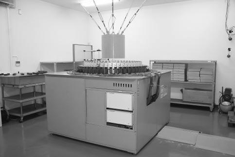 5 Photograph of gamma-ray calibrator (middle level) from an irradiator and an apparatus (automatic conveyor) in which the device to be calibrated is placed, and calibrates with the dose equivalent of