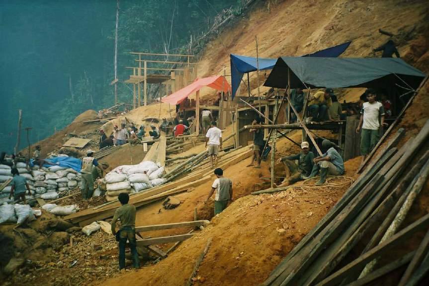 Photo 13. Photograph showing local miners at Mamuring. In 2002 a local mining operation commenced at Mamuring.