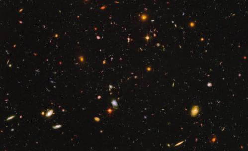 Figure 24 This Hubble view looks deep into space and time when the universe was more chaotic and oddly shaped galaxies were common.