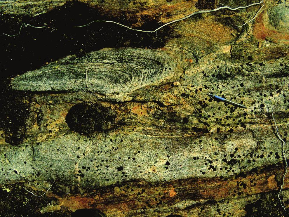 P. VALLEY Plate 6. Kinematic indicators indicative of right-lateral transpression. A) Sheared mafic layer in Archean charnockite.