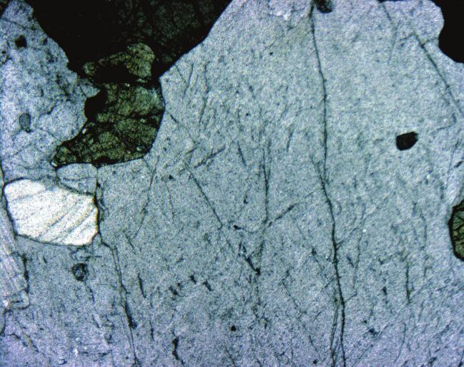 plg = plagioclase; ksp = potassium feldspar; opx = orthopyroxene; cpx = clinopyroxene. bronorite. Mafic enclaves or pyroxene-rich pods are found locally in the charnockite.