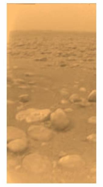 Exploring Titan On the surface, Huygens found many rounded boulders made of water ice.