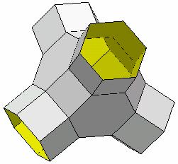A simple example of a polyhedral network or polynet, constructed from truncated octahedra and hexagonal prisms. The building process indicated produces a labyrinth.