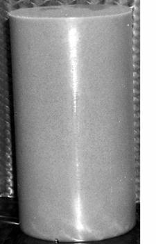 960 kg/ m3. The mixture was cast in the shape of a cylinder 12.7 cm long and 7.0 cm in diameter. Figure 4.4 shows an example of a projectile before and after impact.