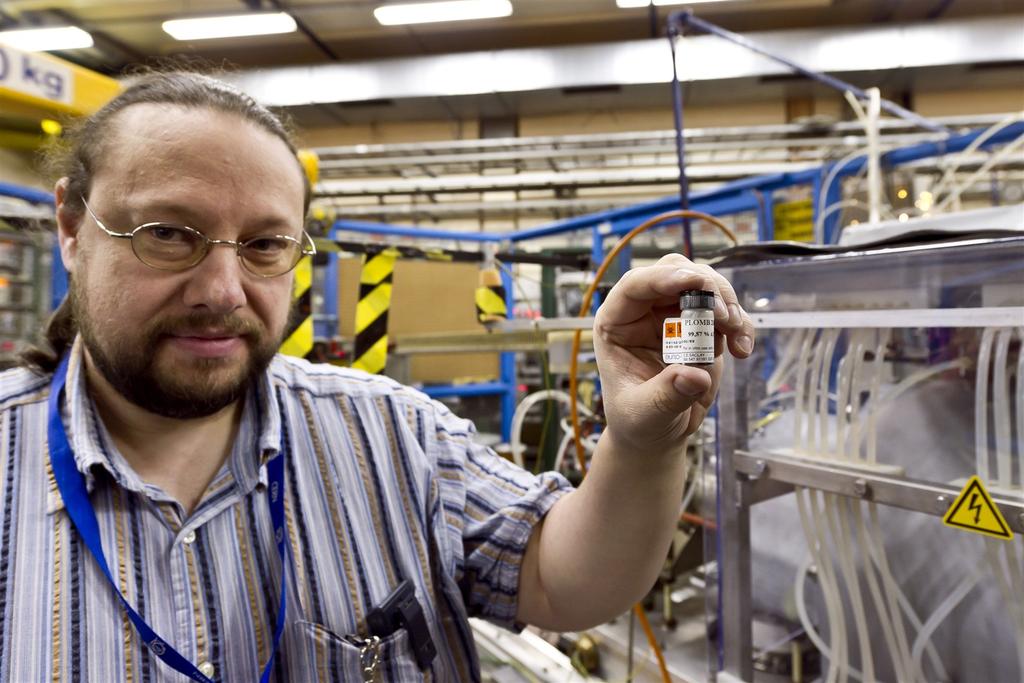 Lead Ion beams at the LHC Detlef Kuchler, a physicist in CERN's Beams department, with the container holding the purified sample of lead used to create