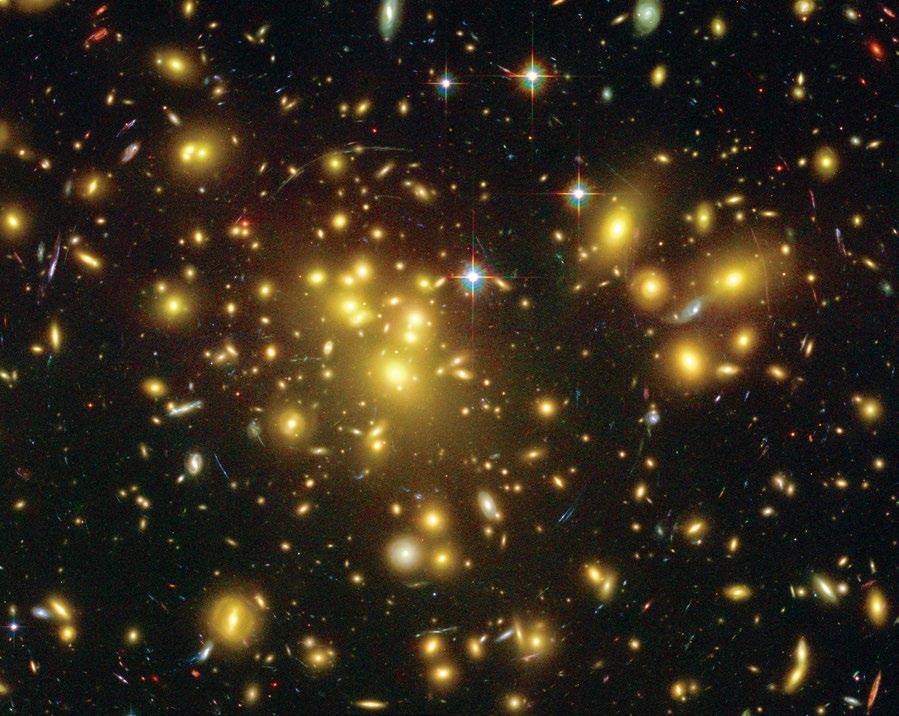 Right: A dark-matter map, shown in blue, is superimposed over the visible-light image of the cluster.