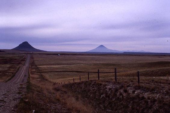 Figure 15.4. Haystack Butte (left) and Middle Butte (right) of the Sweetgrass Hills, north-central Montana (view west).