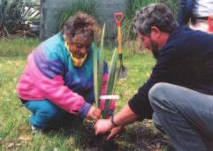 Saana Murray tells her harakeke to grow tall and strong. Students planting harakeke, Kaitaia College. Nathan and the students of the bilingual unit and a speech of welcome from Principal John Locke.