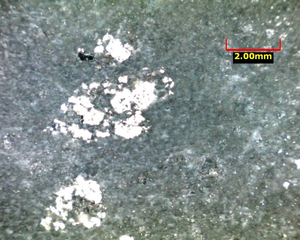 volcaniclasts (void filling? by alteration). The highest XRF copper values tend to be with these stringers. 3) Siliceous sulfide and sulfide clasts (Figs. 16 and 17).