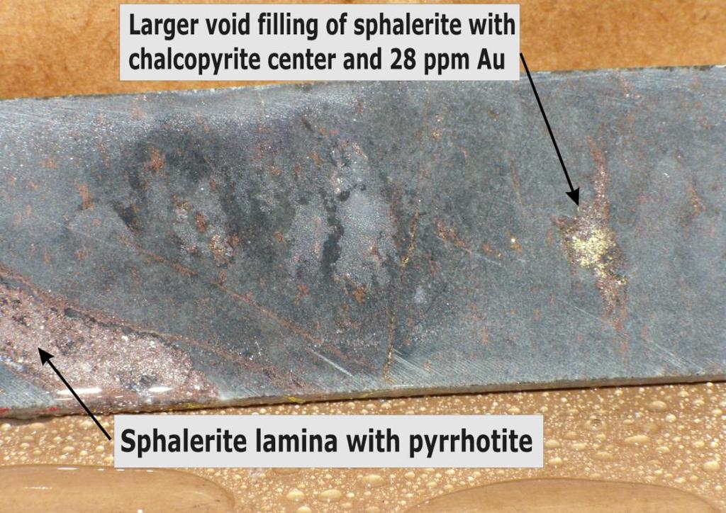 Sphalerite associated with magnetite/pyrrhotite, and is somewhat magnetic. Larger volcaniclast? (?) Figure 35. DDH SXL-4 @ 296.