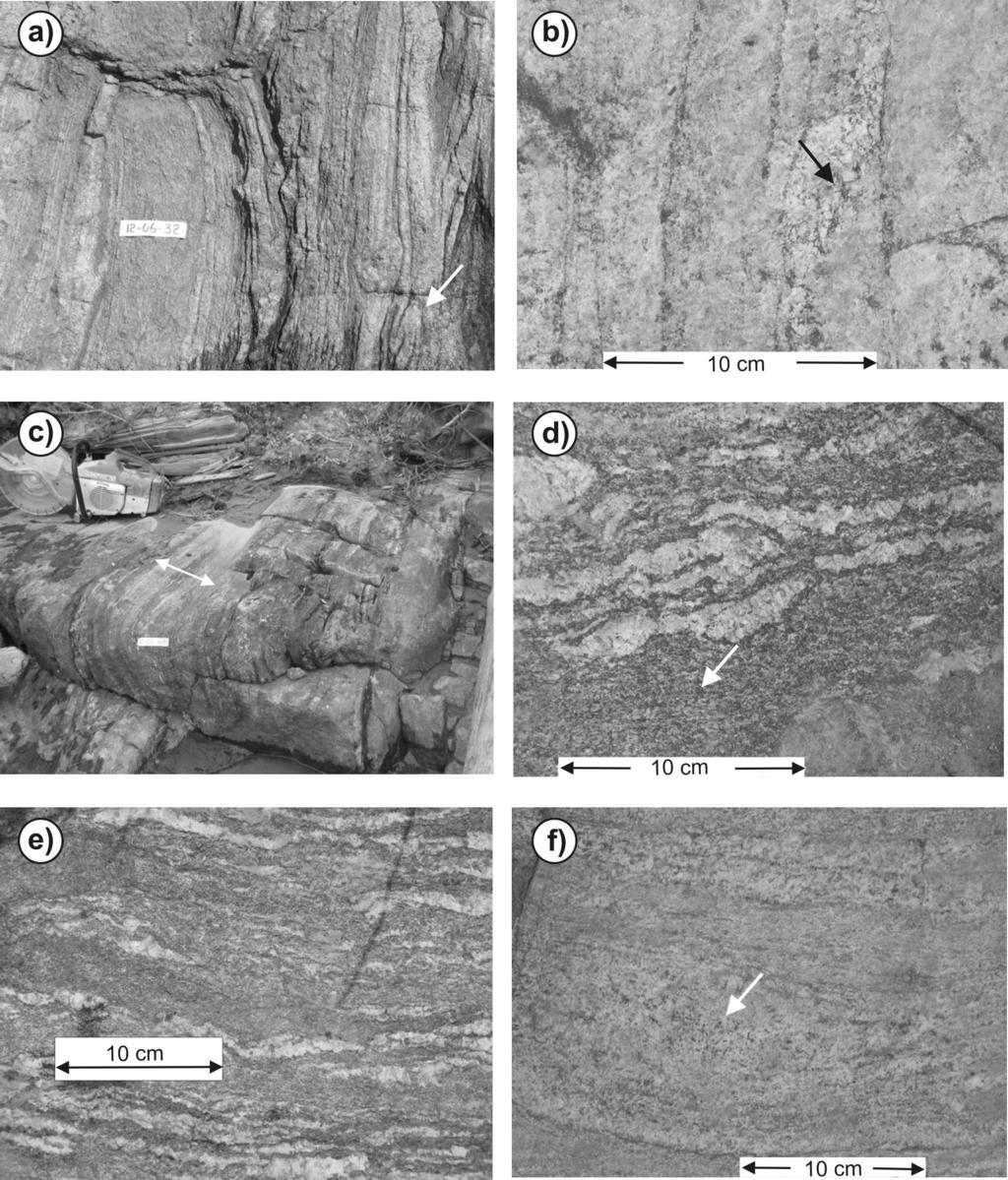 Figure GS-9-3: Typical units in the Wuskwatim Lake area, northeastern Kisseynew Domain: a) layered multicomponent biotite-granulite, showing local isoclinal intrafolial folds (arrow); tape is 10 cm