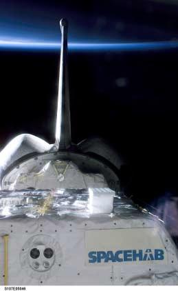 Page 12,Total: 12 Figure 7. Photograph of the SpaceHab module taken during the flight. Please note the apparent diffuse scattering off the top MLI of the SpaceHab module.