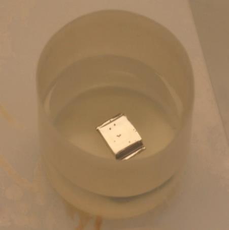 Appendices has a high etch rate for germanium. The crystal is submerged in ~200 ml 4:1 HNO 3 :HF and continuously moved around by rotating the container for 2-3 minutes. Figure A.5.