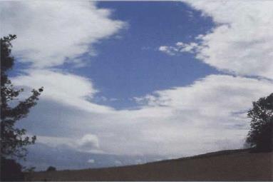 Figure F 2: Photo depicting Altocumulus (lenticular) clouds Altocumulus and Altostratus Layers of altostratus and altocumulus frequently occur together as