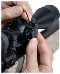 Use of thumb and forefinger on the short end of the hex wrench will provide sufficient force. Align the elevation turret cap.