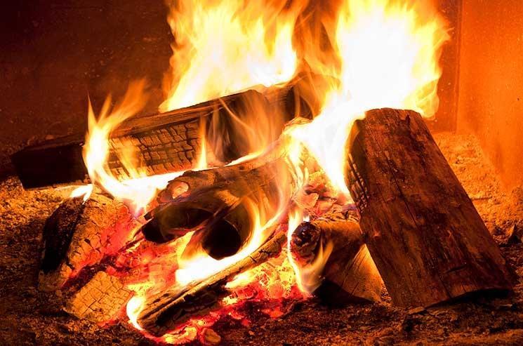 As you watch a fire in the fireplace, you are seeing the wood burn and a chemical