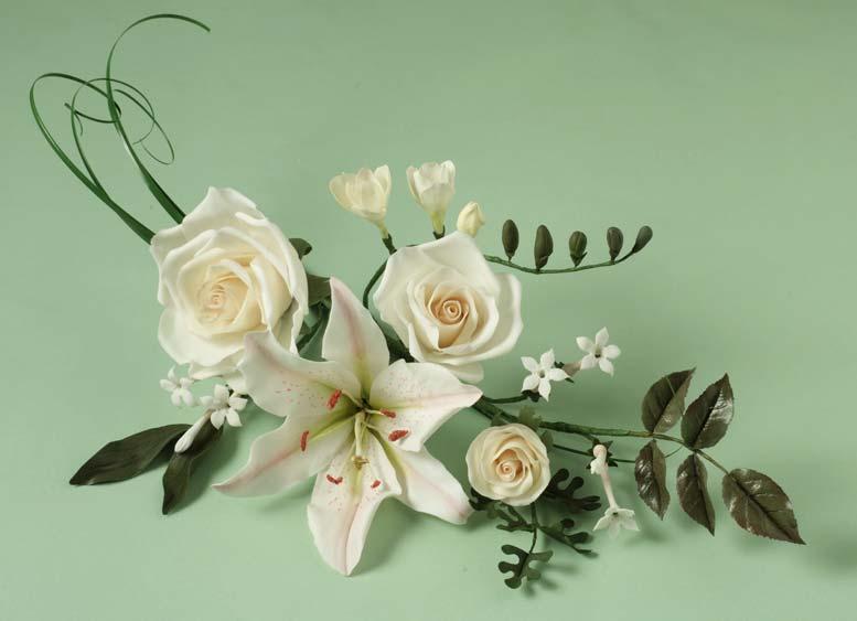 Skill Level 3 (of 4) A single large rose makes a stunning decoration for a cake top or as a combination with lilies, stephanotis freesia and bear grass.