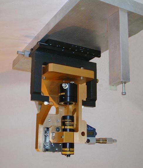 detector assembly is mounted on a stage with a micrometer drive. The stage is mounted on a frame with tooling balls. The wire's position can be obtained relative to the tooling balls.