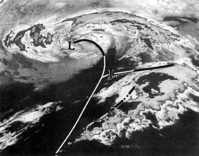 surface position of an occluded front and the rear edge of the spiraling cloud band on satellite imagery (Fig. 8a).