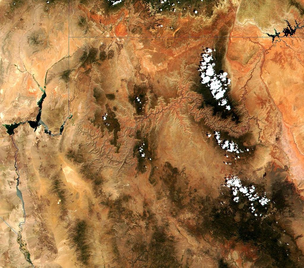 This satellite image shows the Colorado River from Lake Powell on the border of Utah and Arizona (upper right) through the Grand Canyon to Lake Mead (center left)