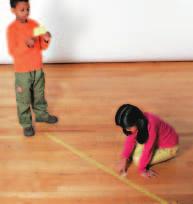 Measure 3 m from the edge of the tape. Mark this distance with tape. Label it Three Meters. Continue to measure and label 3-m distances four more times.