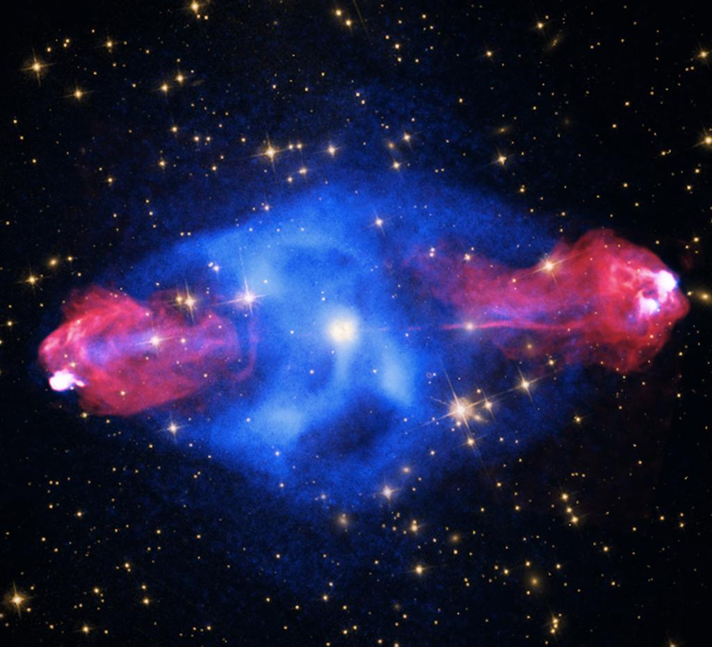 NOVEBER 0 CYGNU A is galaxy, at a distance of some 00 million light years, contains a giant bubble filled with hot, X-ray emitting gas detected by Chandra (blue).