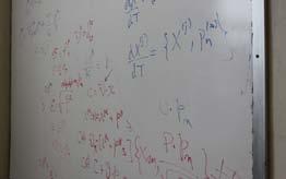 B S J Figure 1. Calculations that run across the whiteboard located across from Speliotopolous desk. RMS fluctuations and have it check, within experimental error, with what is measured.