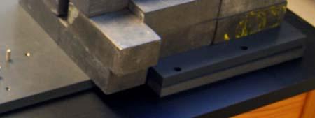 Lead bricks surrounding the steel collimator tube are essential.