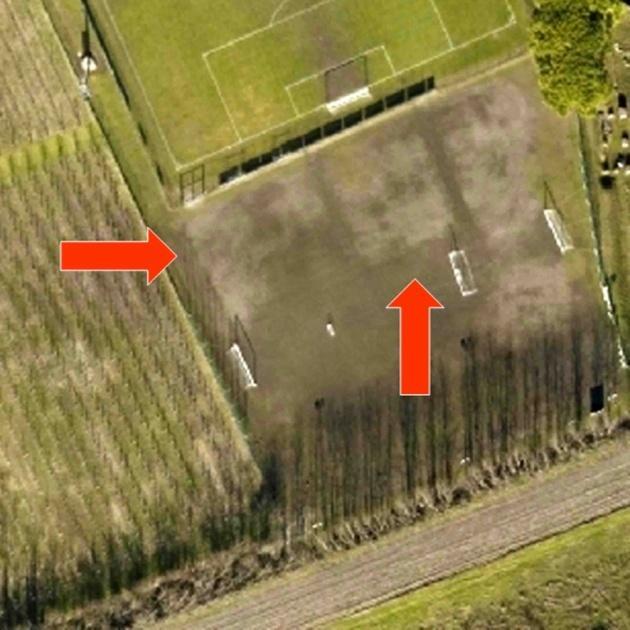 On the same orthophoto, S of a football field three blocks are