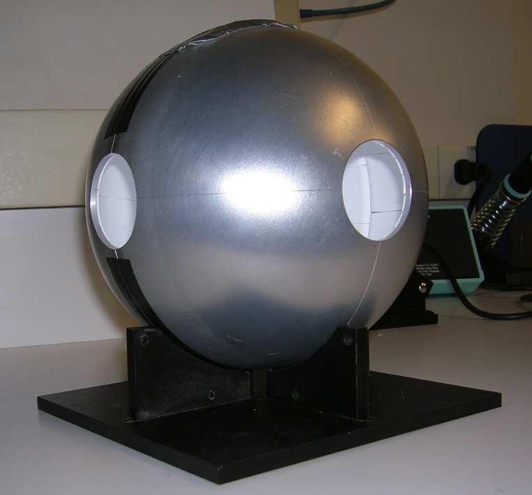 3 Figure 3. The integrating sphere used in the measurements. The diffusive coating applied to the interior can be seen through two of the ports. 1.