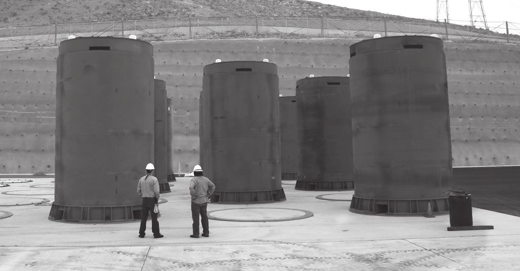 Used nuclear fuel is often stored in large used fuel casks at a nuclear power plant.