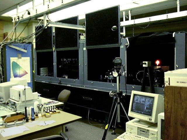 A lamp is placed on the carriage and aligned with the telescopes, and the photometric signal is measured with one of several photometers placed on the carousel at