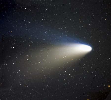 Comets Comets are beautiful white objects with a tail. They move slowly across the sky. A comet is made of ice, frozen gases, rocks, and dust. When a comet moves close to the Sun, it gets warmer.