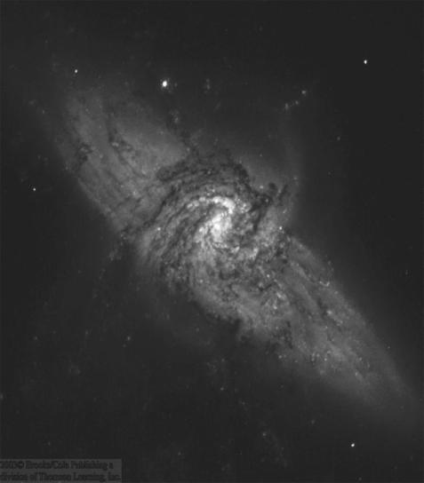 The Nature of Spiral Arms Chance coincidence of small spiral galaxy in front of a