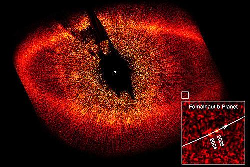 Scientists take first photos of planets orbiting other stars NASA/ESA The newly discovered planet Fomalhaut b sits inside the dust belt surrounding the star Fomalhaut.
