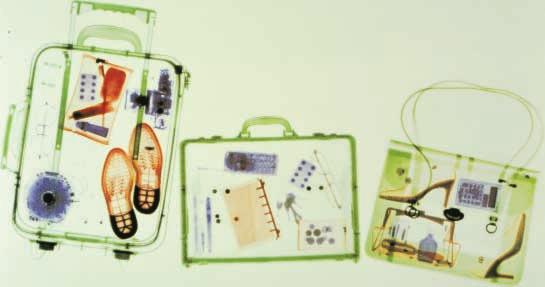 An X ray of a suitcase, a briefcase, and a handbag reveals their contents. What objects can you identify?