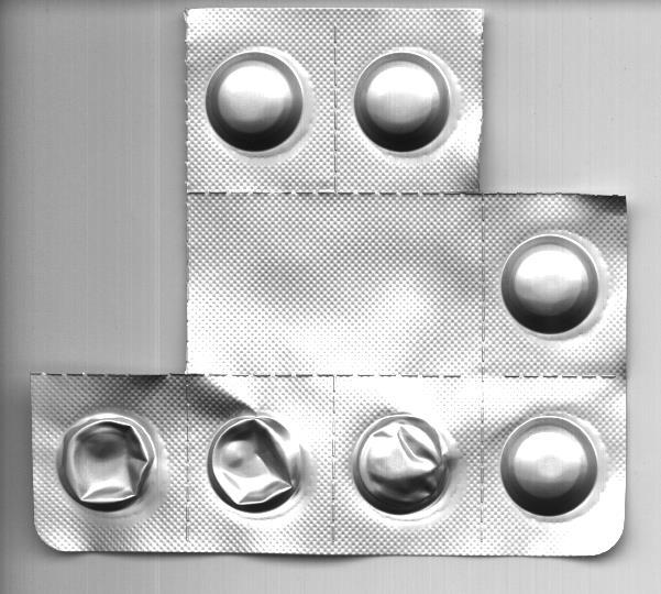 Multi-layered Drug Package Optical photograph of encapsulated drug tablets SPS Photograph Cross-section of