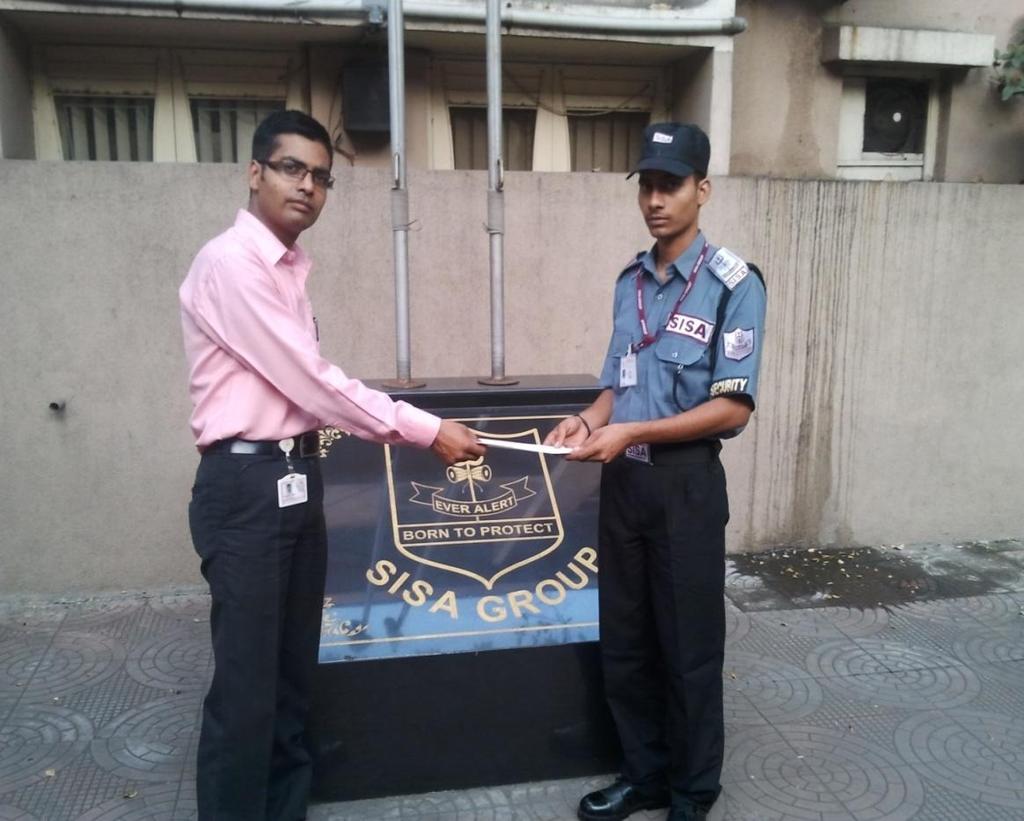 Mr. Reeturaj Thakur (Sr. Manager TRG) rewarding Mr.Pawan Kumar (Security Guard) of Inter Gold Gem for exhibiting his Brave act on duty.