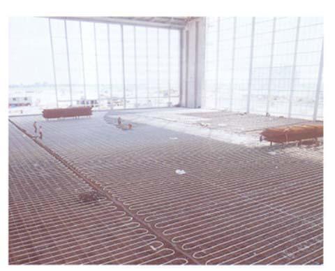 2324, Page 2 Figure 1: Picture of piping for heated floor system during installation (Olesen, 2011) Figure 2: Picture of the radiative HX installed in an office setting 2.
