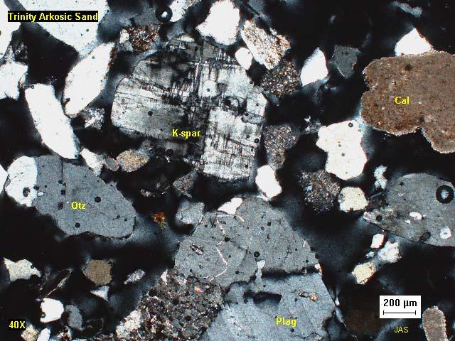 Photomicrographs of Trinity arkosic sand The presence of carbonate grains in the sand most likely