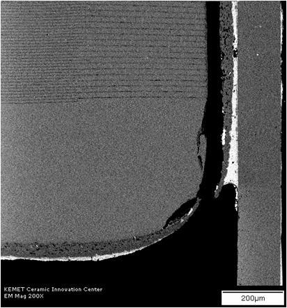 5mm flexure. Figure 4. A typical board flexure failure for 2220 J-Lead Stack at > 7.5mm flexure. The MLCC crack begins at the end of the termination and in the case shown (Figure 3.