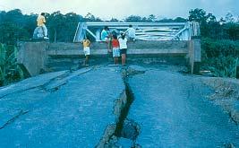 bridge Cracked and settled highway embankment at