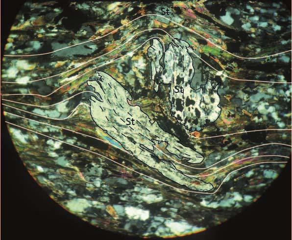 Quartz, actinolite and opaque minerals are present in relatively high concentrations. Additional minerals include titanite and biotite.
