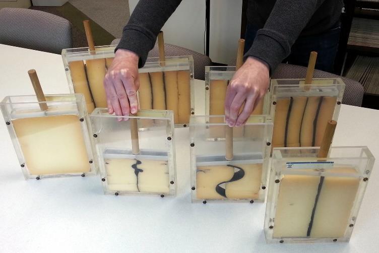 (b) Boxes with rubber bands show folds with arc lengths varying as a function of thickness