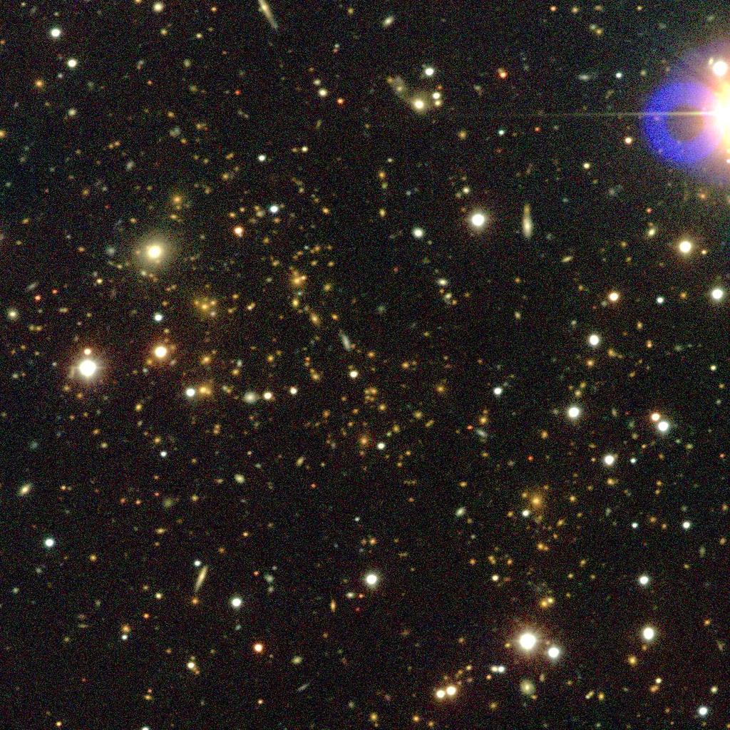 This luminosity acts as a tracer of the dark matter in the cluster, which makes up most of the cluster s mass. FIG. 3: Optical image of the cluster MACSJ1423.8+2404 at redshift z=0.