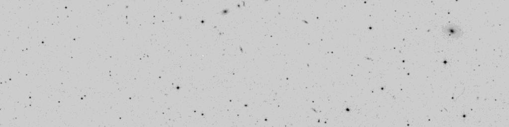 Starting with the labeled galaxy, MAC 1449+1100, is a very faint 2:1